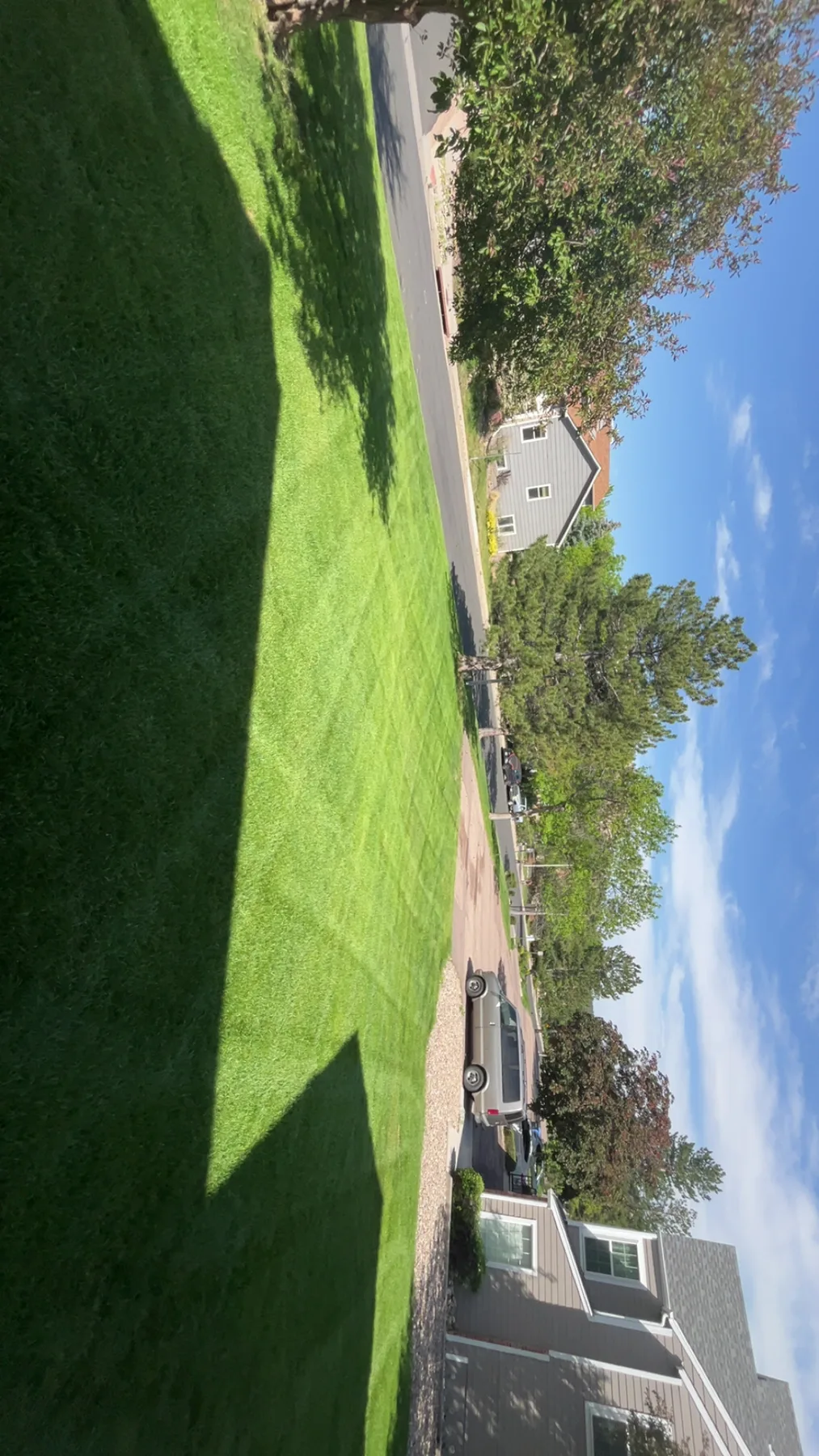 Residential lawn maintained by Summit Shield Landscaping